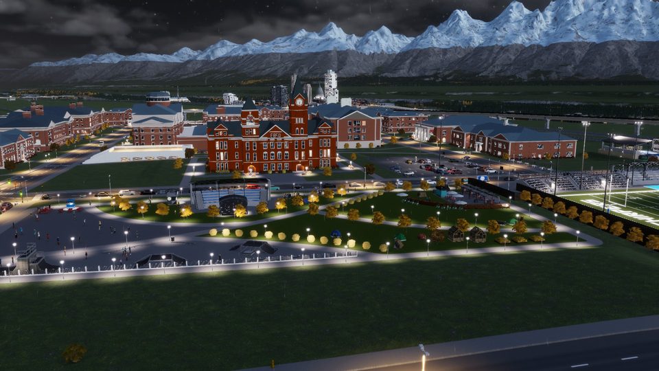A university quad at night with a lit clock tower and dormitories anchoring the campus, from a real Cities: Skylines II save running EduLife